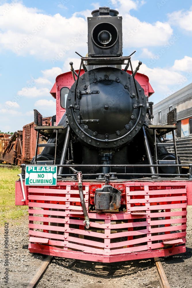 Obraz premium Red Cow Catcher on Old Black Locomotive