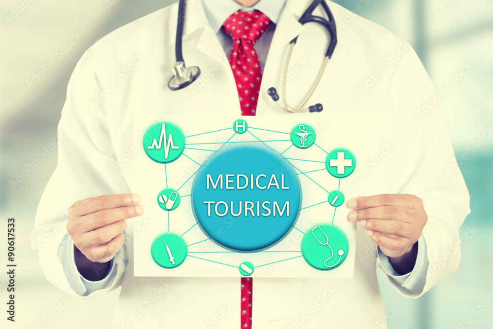 doctor hands holding card sign with medical tourism message doctor hands holding card sign with medical tourism message
