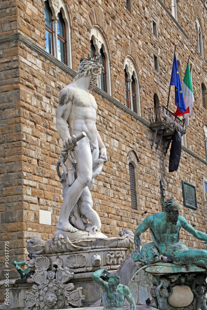White statue of Neptune in the fountain in Florence
