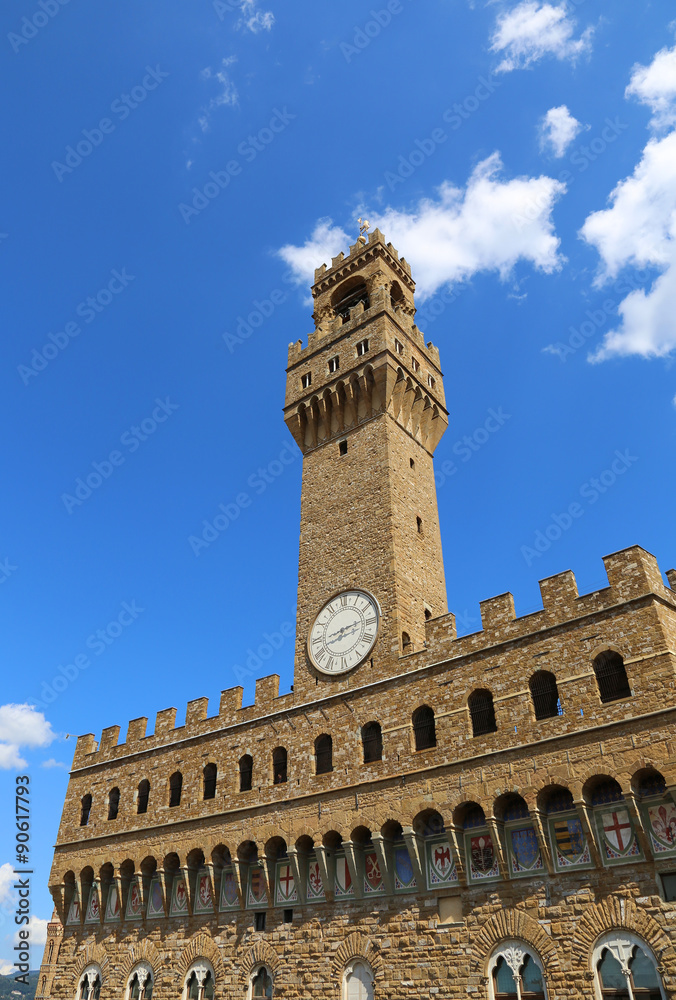 Old Palace with clock tower with blue sky in Signoria square in