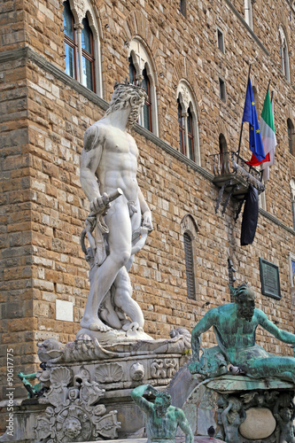 White statue of Neptune in the fountain in Florence