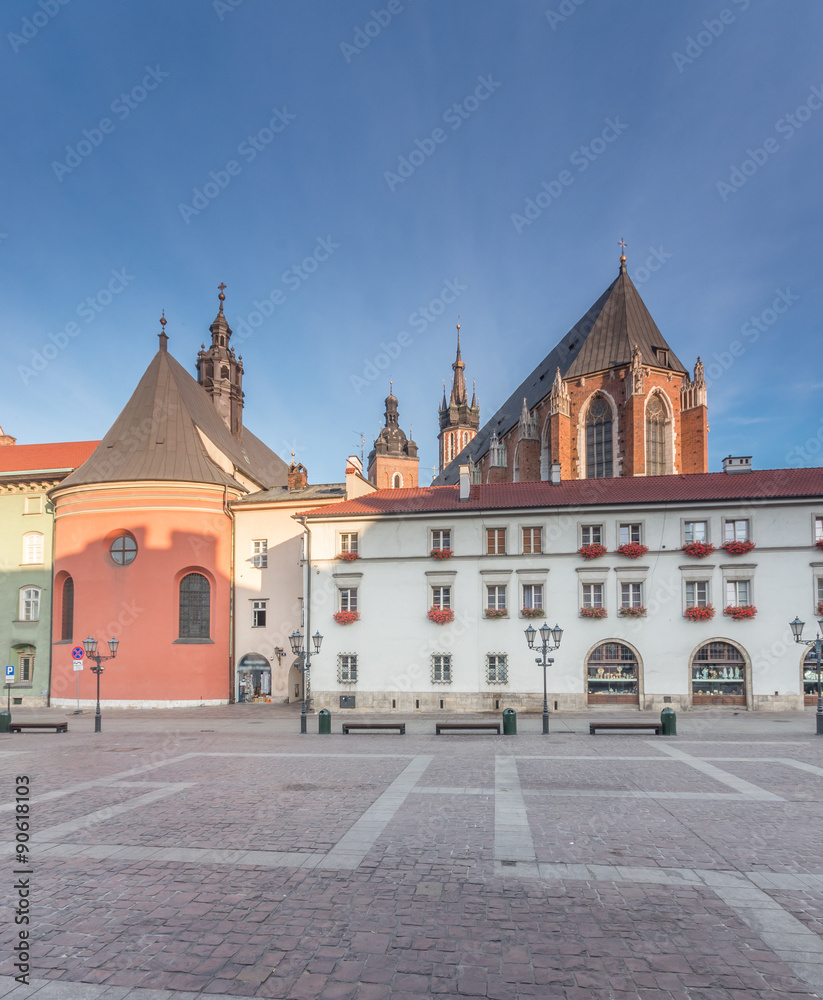Naklejka premium Small Market Square in Krakow, Poland, with St Mary's church and St Barbara's church