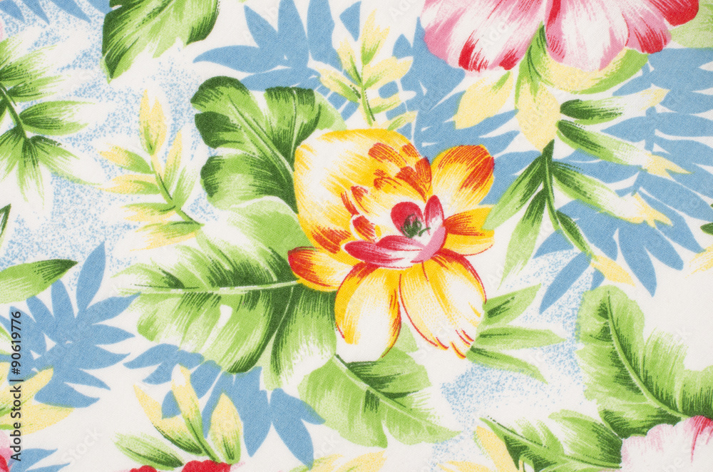 Fototapeta premium Floral pattern on fabric. Yellow and pink big flower with green and blue leaves print as background.