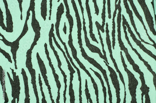 Green and black zebra pattern. Striped animal print as background.