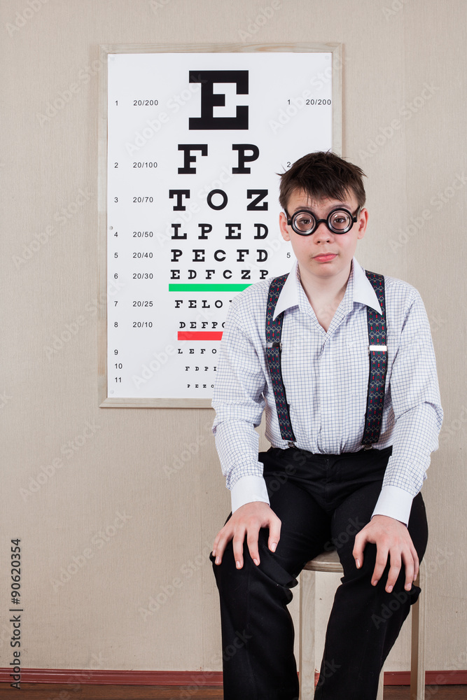person wearing spectacles in an office at the doctor person wearing spectacles in an office at the doctor