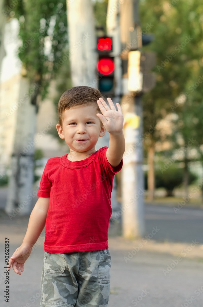 Fototapeta premium Happy child making a stop sign