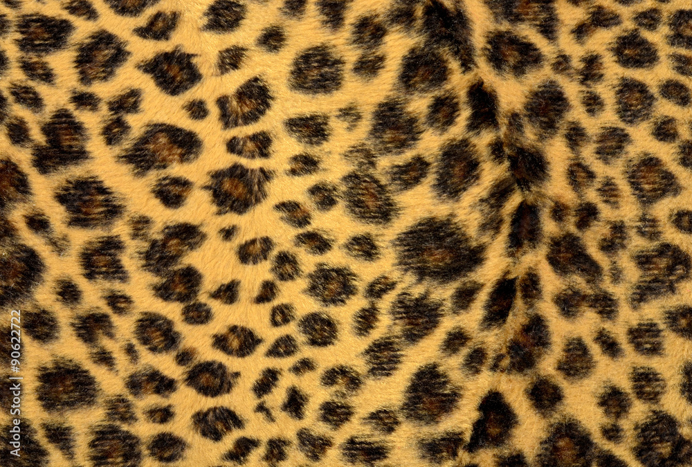 Brown leopard fur pattern. Spotted animal print as background. Brown leopard fur pattern. Spotted animal print as background.