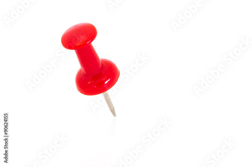 Single red pin isolated on a white background