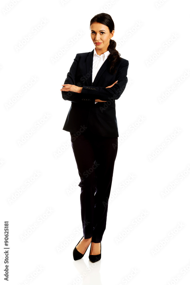 Businesswoman standing with folded arms Businesswoman standing with folded arms