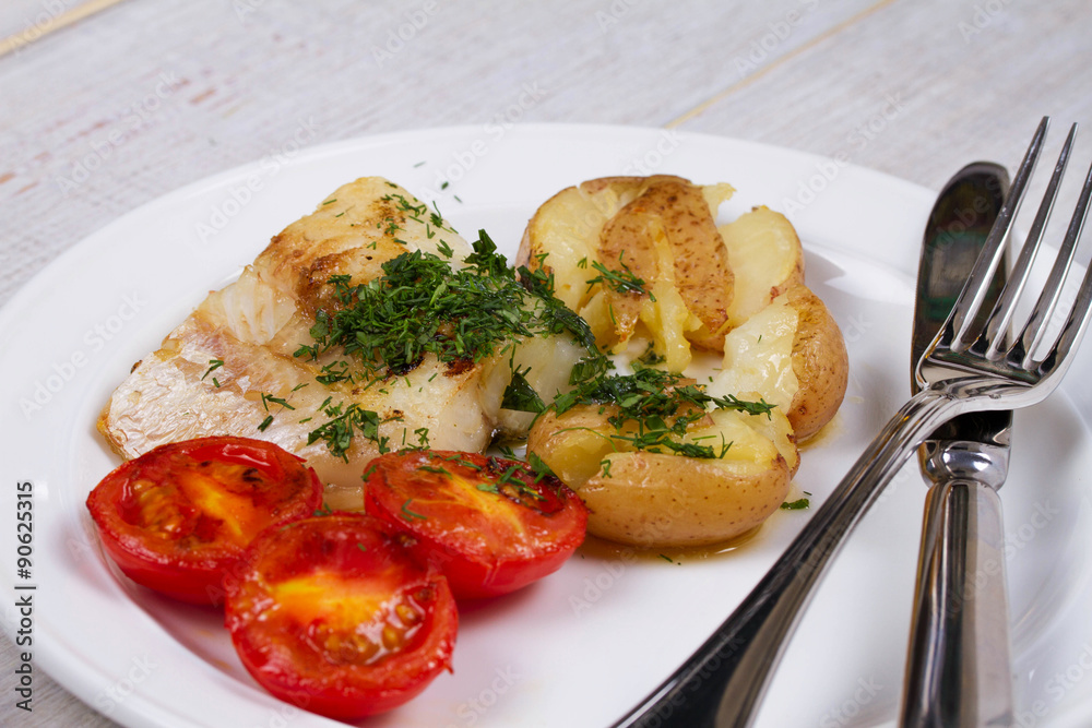 Fish Fillets with Herbs, Crispy Potatoes and  Roasted Tomatoes