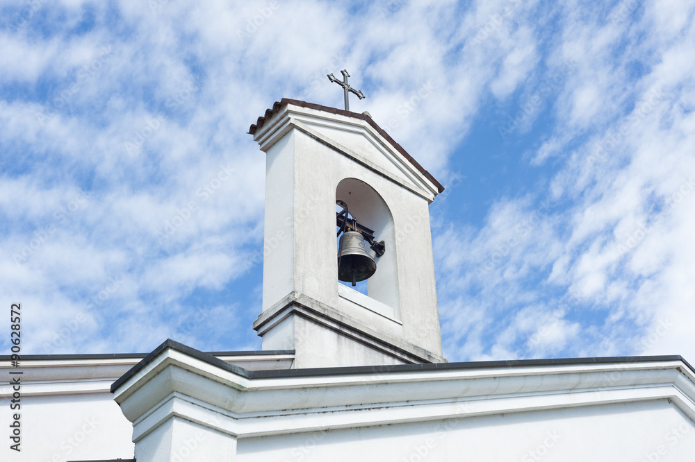 Small bell tower with a bell of a country church i