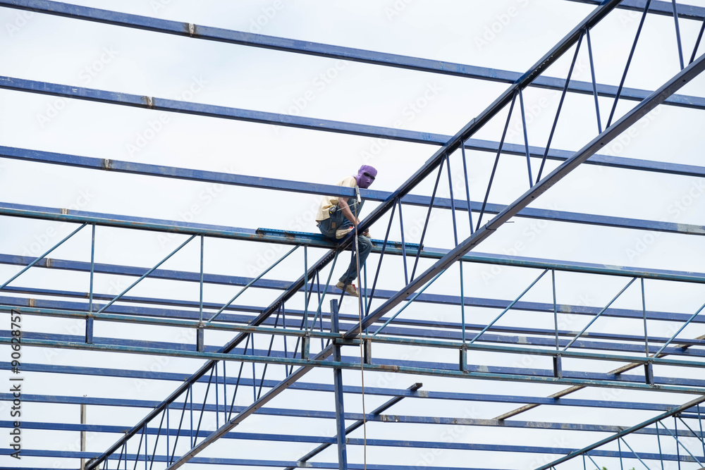 Construction worker building in daytime