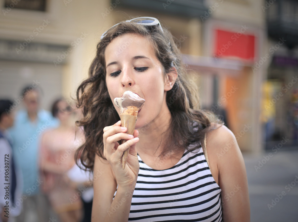 Young woman eating ice cream Young woman eating ice cream