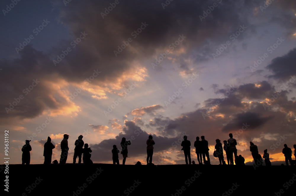 Many people waiting to see sunrise on top of the mountian Many people waiting to see sunrise on top of the mountian
