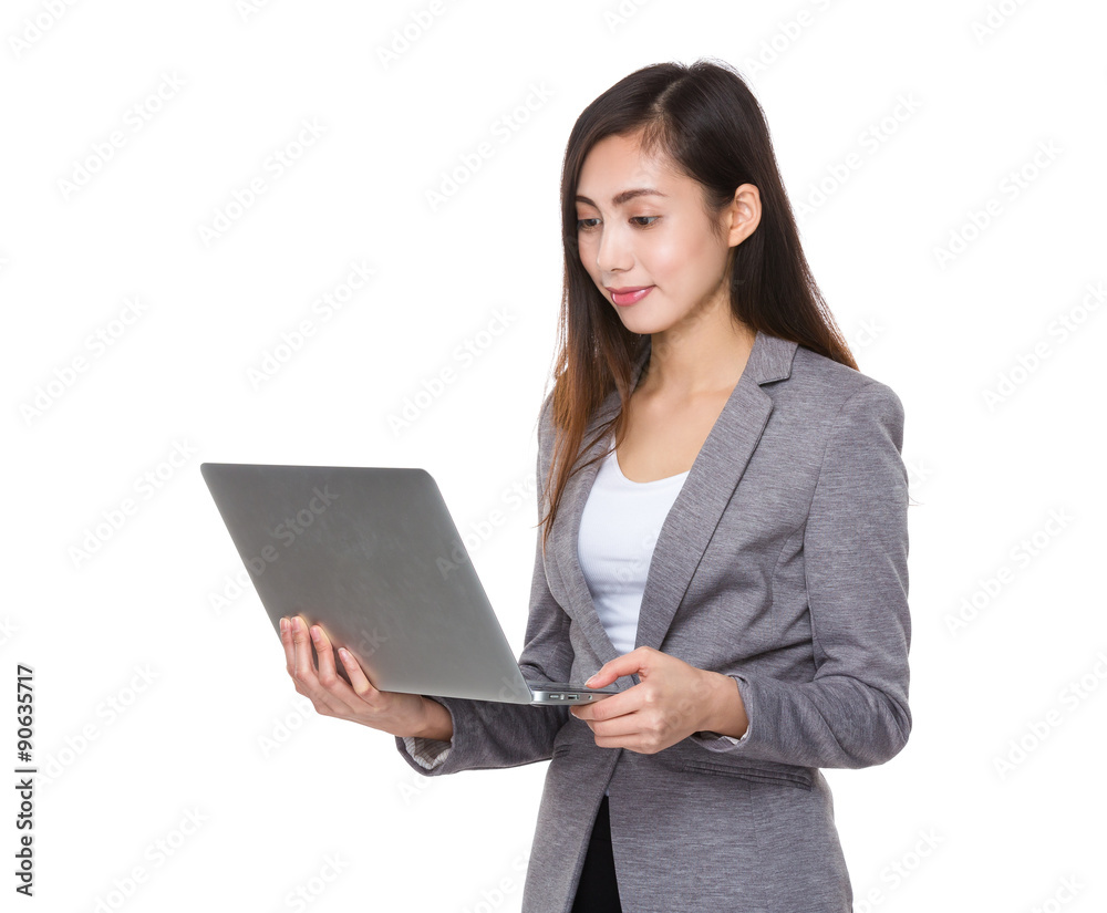 Businesswoman watch on the laptop computer Businesswoman watch on the laptop computer