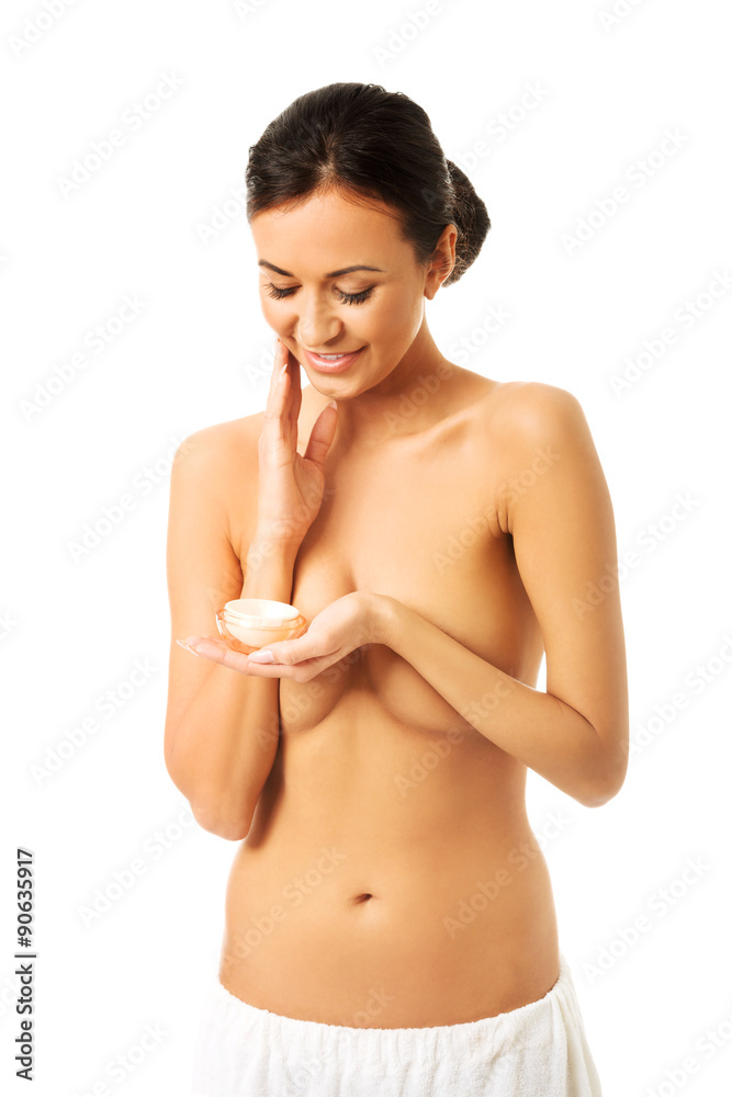 Fototapeta premium Topless woman with cream container