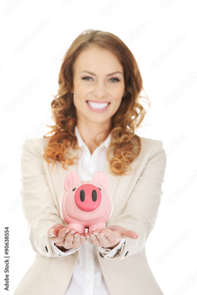 Business woman with a piggybank.
