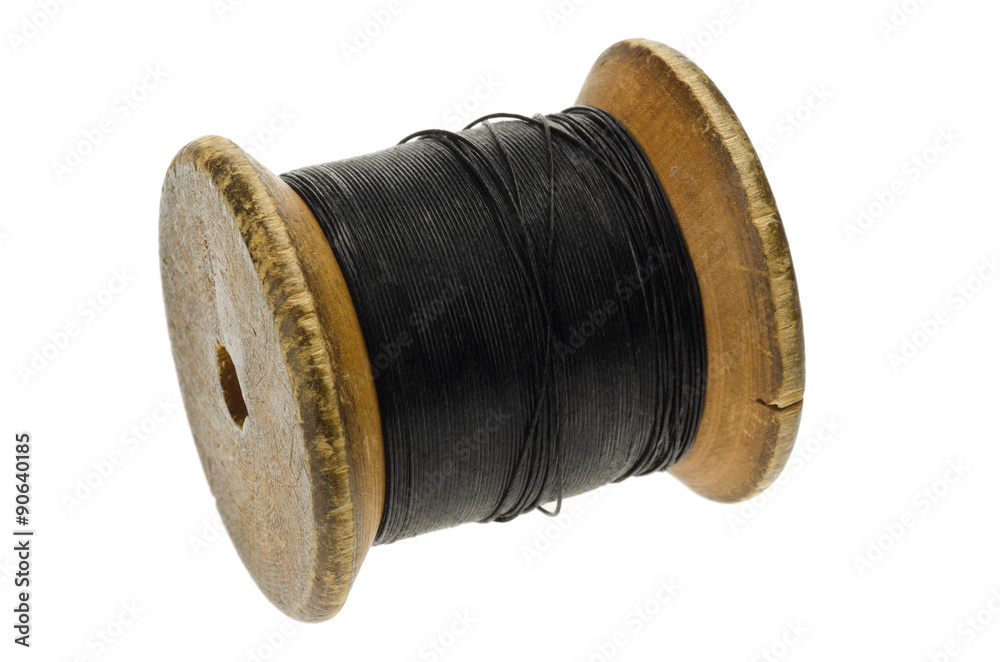 Wooden Cotton Reel with Black Thread Stock Photo