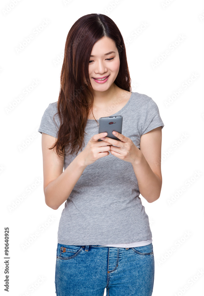 Asian woman read on the cellphone Asian woman read on the cellphone