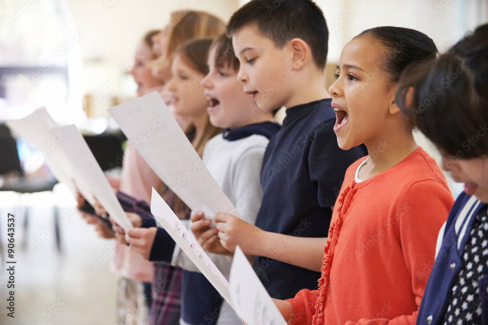 Group Of School Children Singing In Choir Together - obrazy, fototapety, plakaty 