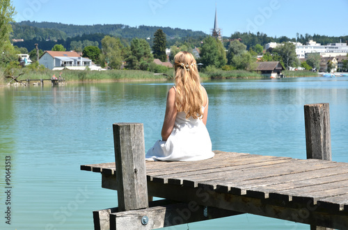 Girl on the wooden jetty. Switzerland © HappyAlex
