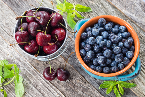 Cherry and Blueberry on a wooden table