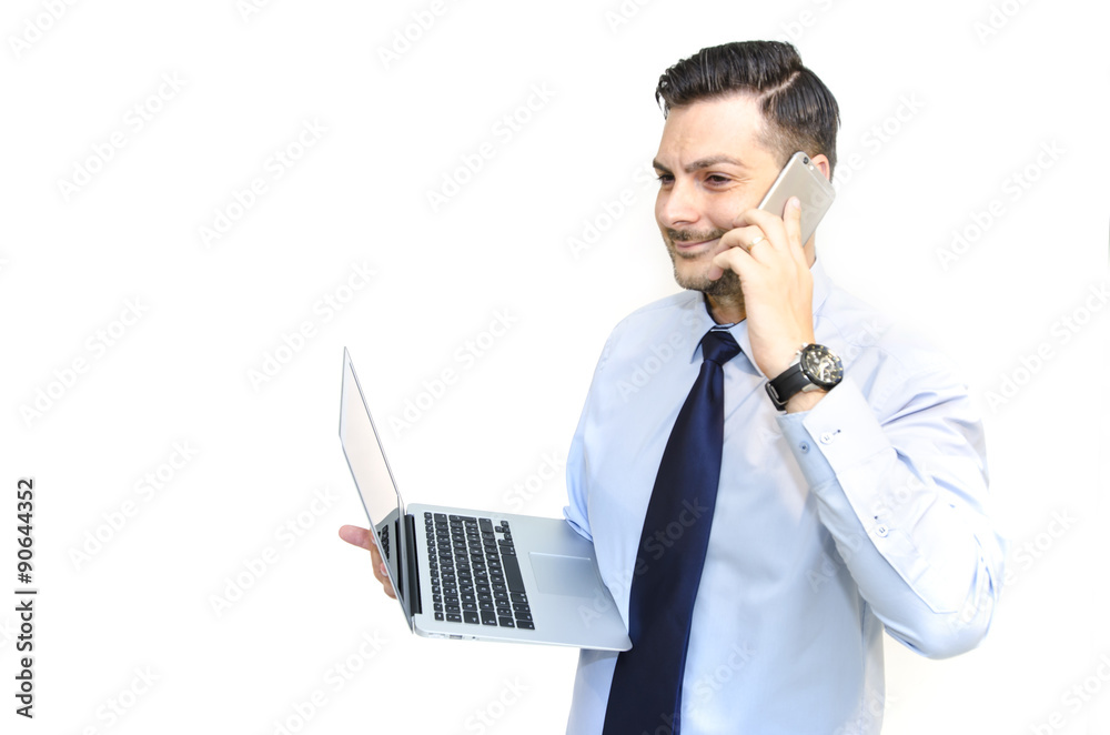 Businessman holding laptop and using phone isolated Businessman holding laptop and using phone isolated