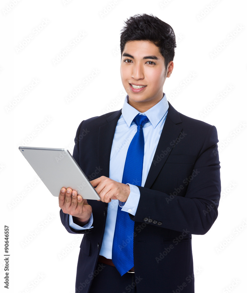 Young businessman use of the tablet pc