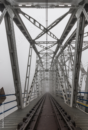 Superstructure of railway steel truss bridge in Krakow, Poland, over Vistula river #90648355