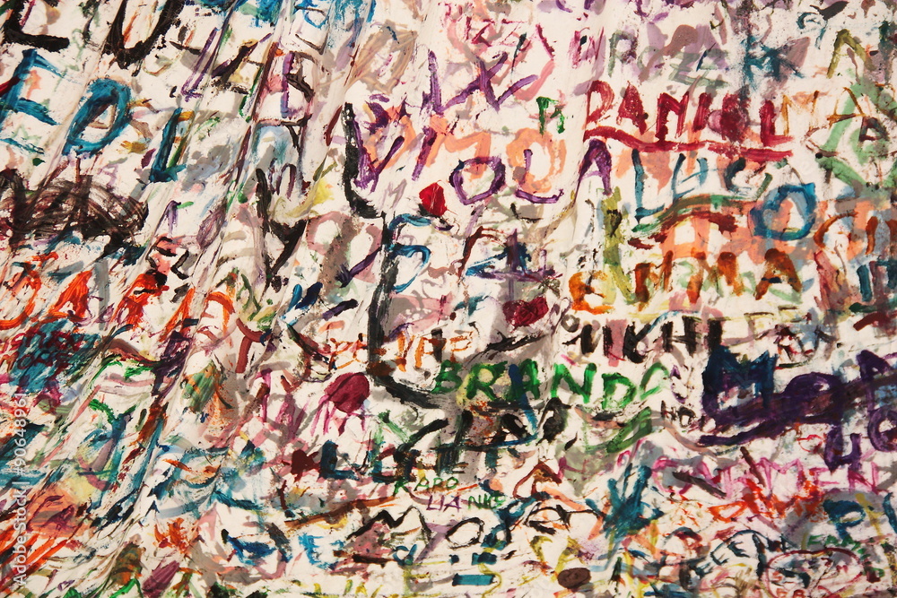 Children names painted in different colours on a white blanket Children names painted in different colours on a white blanket