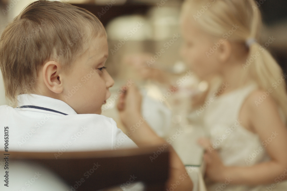children 5-8 years old tea in a cafe