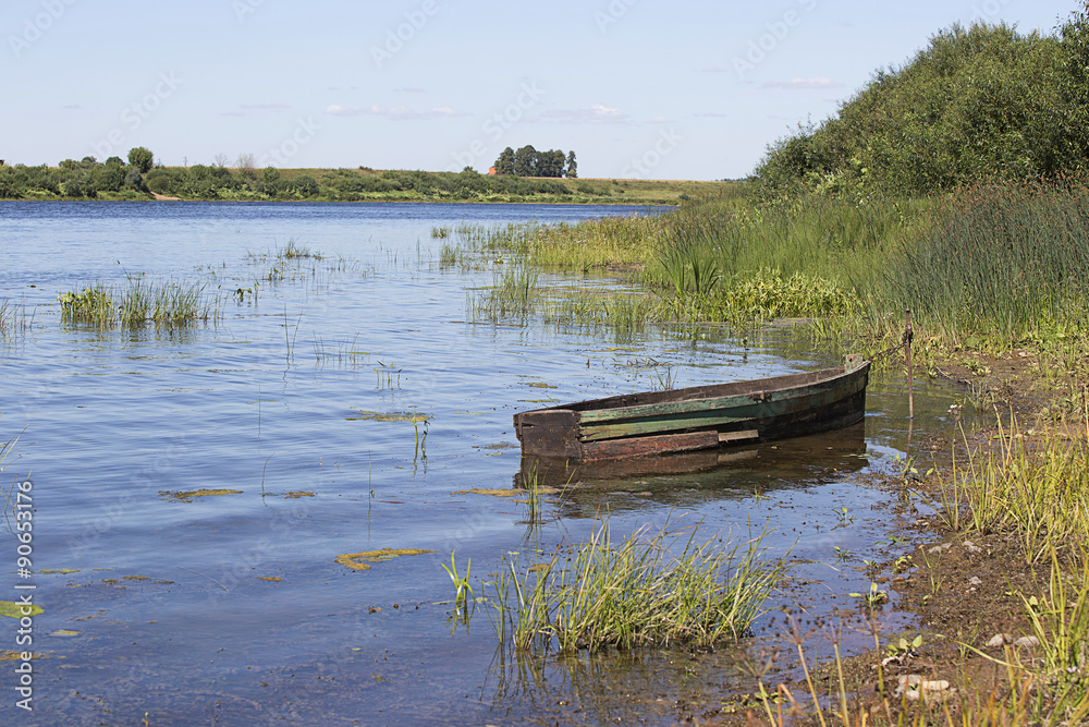 Wooden boat near tte coast Wooden boat near tte coast