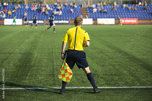 Assistant referee with  flag