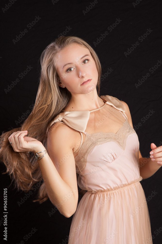 Fototapeta premium Pretty girl with long hair, looking thoughtful