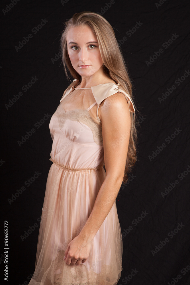 Fototapeta premium Pretty girl with long hair, looking thoughtful