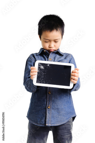 Sad boy hold cracked tablet device