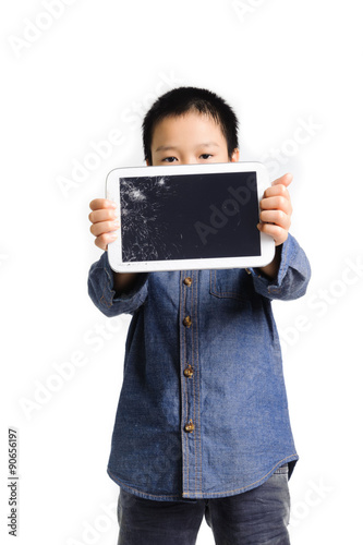 Sad boy hold cracked tablet device