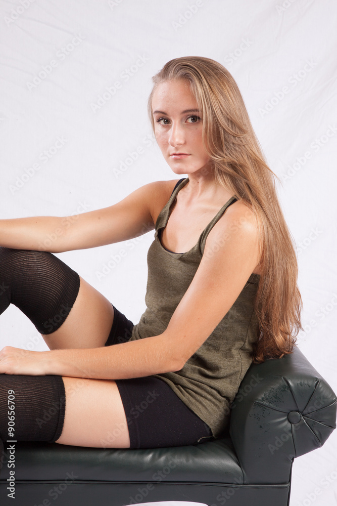 Pretty long haired woman sitting thoughtfully