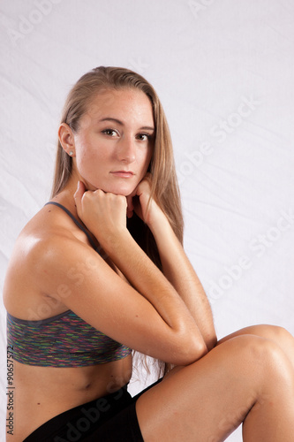Pretty long haired Caucasian woman, sitting thoughtfully