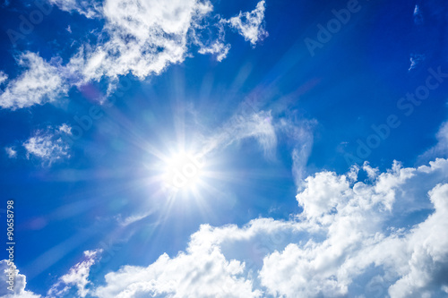 Blurred image of blue-sky with sun for background use