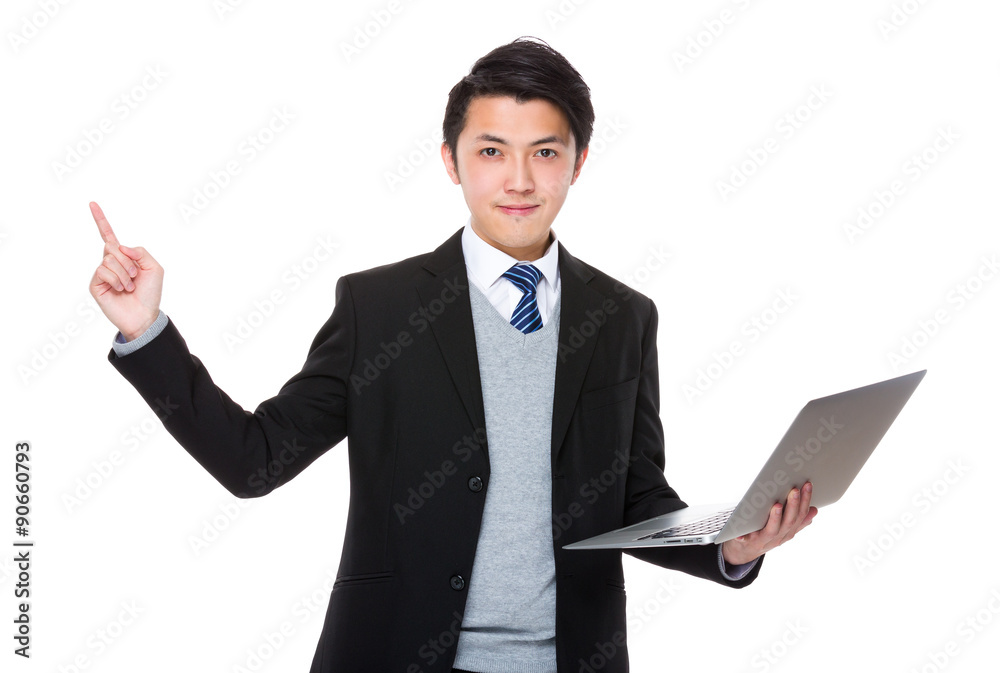 Businessman hold with laptop computer and finger point up Businessman hold with laptop computer and finger point up