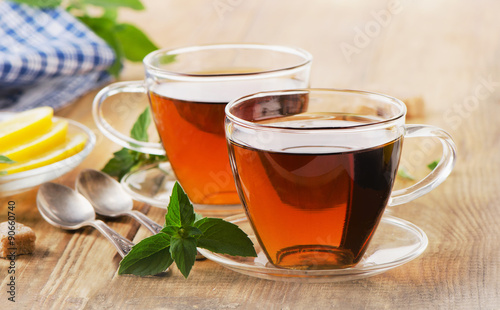 Cups of tea with mint leaves.