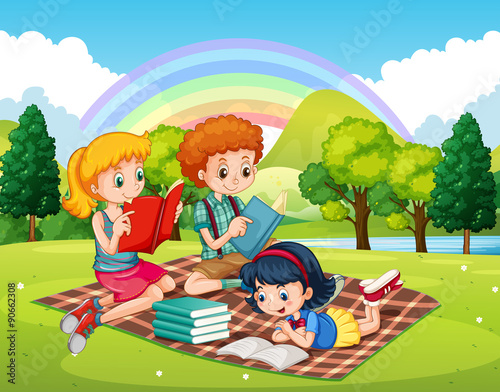 Children reading books in the park