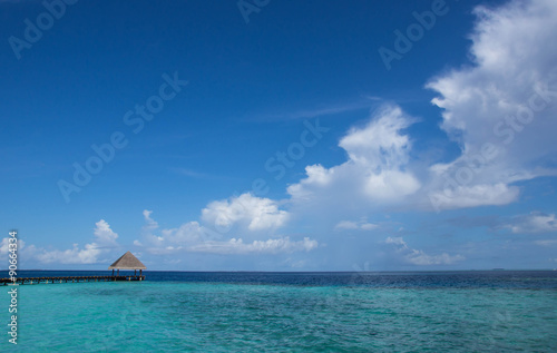 Cloudy sky over the Maldivian resort on a clear day © Talulla