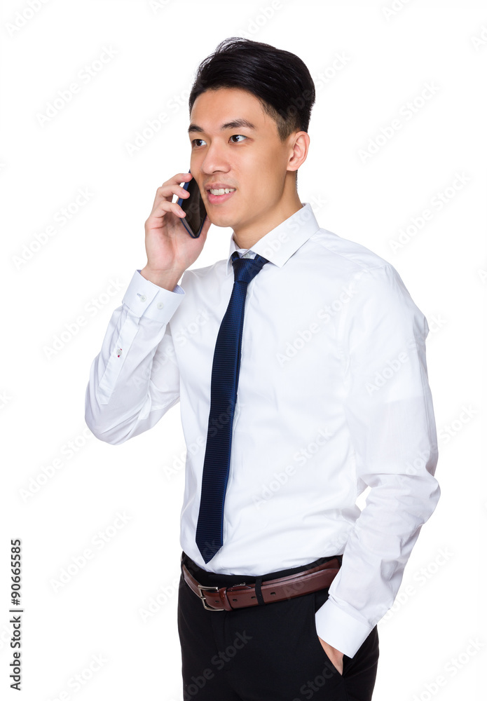 Asian young businessman talk to cellphone Asian young businessman talk to cellphone