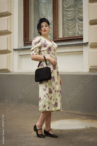 Very beautiful soviet girl in retro style is on the Moscow stree