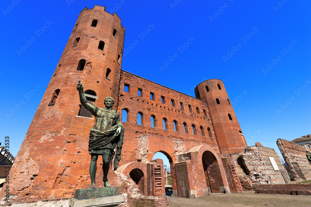 Porta Palatina - Torino Italy / Roman statue of Gaius Octavius Thurinus and ancient ruins of Palatine Towers in Torino, Piemonte, Italy