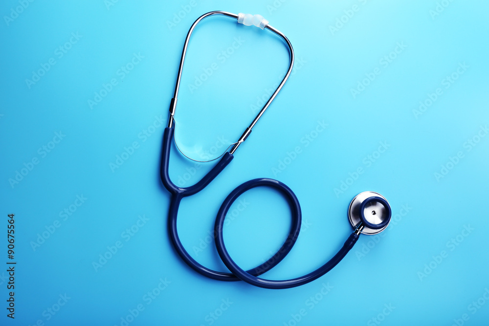 Stethoscope on blue background
