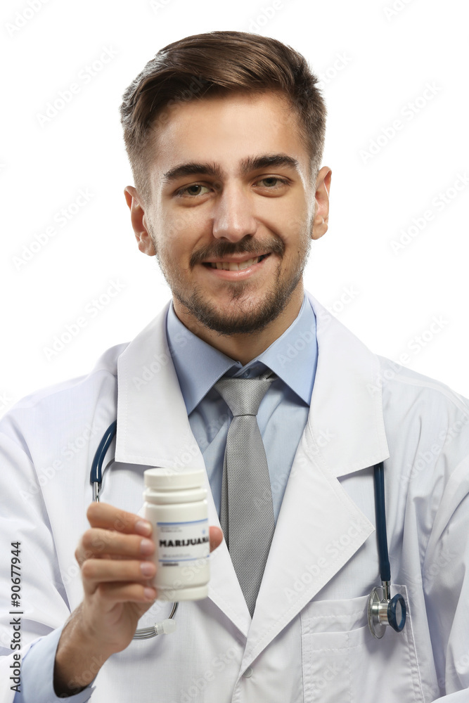 Doctor holding bottle with medical cannabis isolated on white Doctor holding bottle with medical cannabis isolated on white