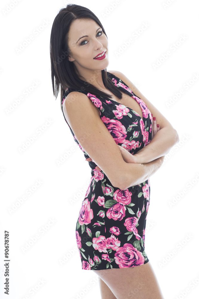 Attractive Young Woman Wearing a Short Floral Playsuit Attractive Young Woman Wearing a Short Floral Playsuit